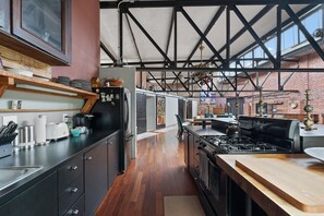 View of from kitchen looking toward light-filled living space 