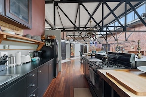 View of from kitchen looking toward light-filled living space 