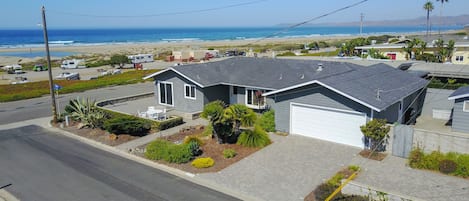 Arial view of the home, enjoy being close enough to the beach to hear the waves!