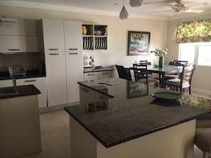 State of the art kitchen with stainless steel appliances and granite