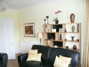 Homely sitting room with plenty of  comfortable seating