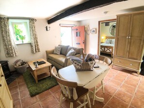 Living/Dining area with cosy underfloor heating and wood burner.