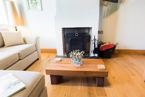 Herne Cottage - Lounge area with woodburner