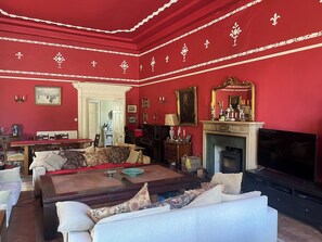 Ballroom - wood burner and TV (Wood shed has loads of wood)