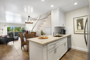 Open kitchen with granite countertops and stain less steel appliances.