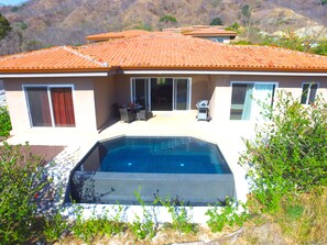 View of plunge pool and patio 