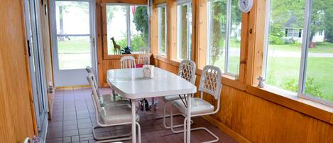 Screened-in porch with a view of the lake