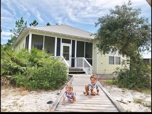 My beautiful granddaughter in front of the cottage
