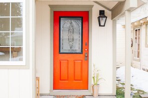 The cottage has lots of character like this distinctive red door.