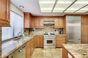 Our upgraded granite kitchen along with Sub Zero refrigerator. 