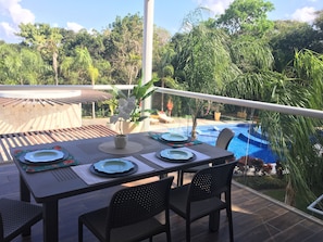 Spacious terrace overlooks the pool.  Great for morning coffee.