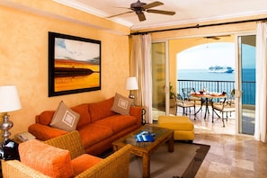 Living Room Area w/ Patio door to Furnished Balcony