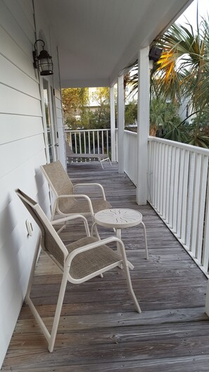Wrap around porch - chairs and loungers.