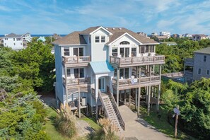 This deluxe 5-bedroom home is conveniently tucked away in Salvo, a short drive to the ocean or sound.