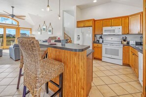 The well-equipped kitchen welcomes — and delights — family chefs.