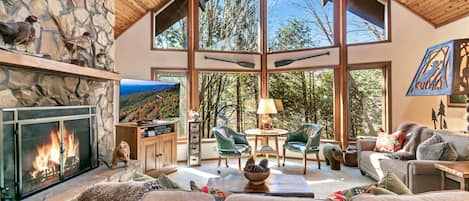 Main Lining Area with Stone Fireplace, Huge Windows and 19-foot Cedar Ceiling.