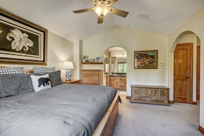 Our rustic bedroom. This includes a king-size bed with a wooden frame.