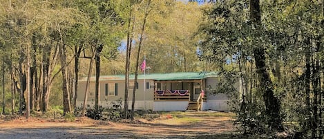 Secluded but only 2 miles from Live Oak on a paved road.