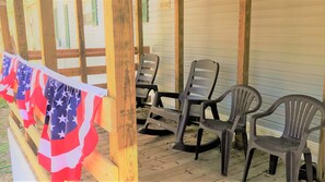Enjoy sunsets thru woods and our firepit from the covered front porch.