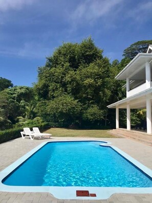 Pool overlooking garden 