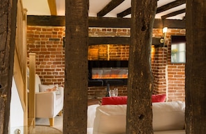 Looking through beams to the lounge from the spacious dining room