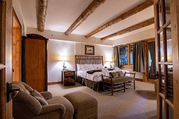 Master bed with a king bed and on suite bathroom! French doors to for privacy