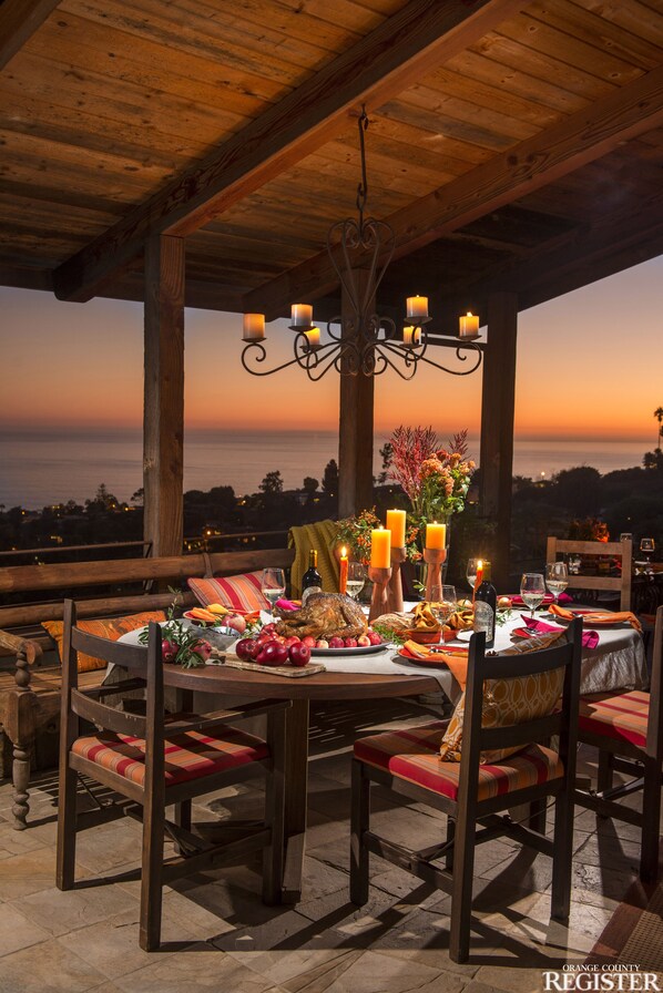 Covered outdoor dining area with panoramic ocean view