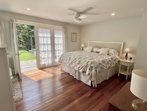 French doors from the main bedroom lead to the porch and garden