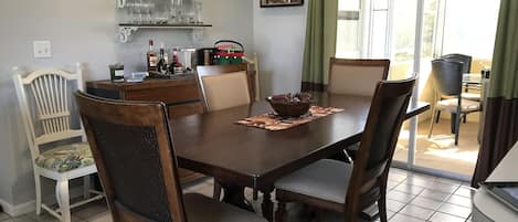 Dining room that seats 8 overlooking screened porch