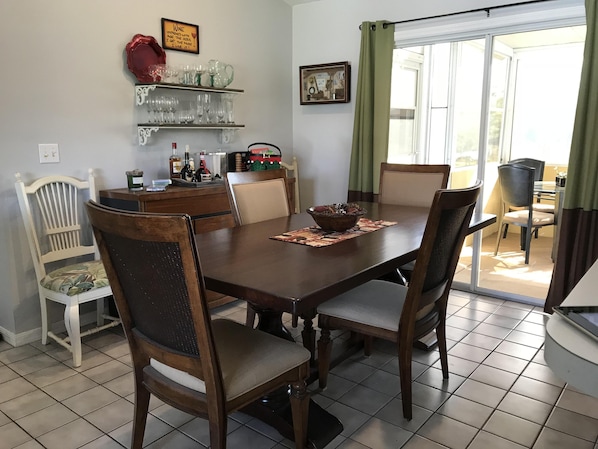 Dining room that seats 8 overlooking screened porch