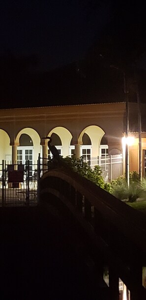 clubhouse from pool at night