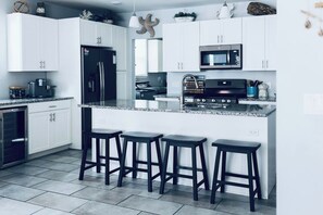 Kitchen | Fully Stocked | Open Concept | Granite Countertops | Stainless Steel Appliances | Wine Fridge | Island | Seating for 4 at Island | Roku TV