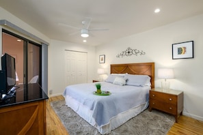 Bright Bedroom boasting a king sized bed.