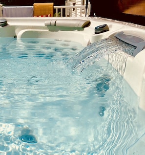 Spa tub has waterfall to relax in after outdoor activities