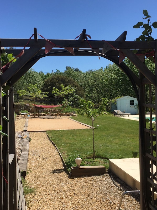 Relax in the hammock critiquing your family ‘s pétanque skills!