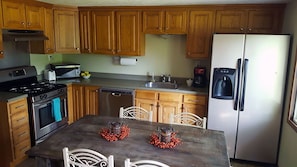 Large kitchen to create a family feast! Easy access to grill located on deck.