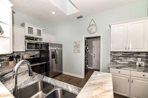 All new kitchen with marble countertops



