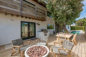 Gas fire pit also overlooking outdoor dining and heated pool