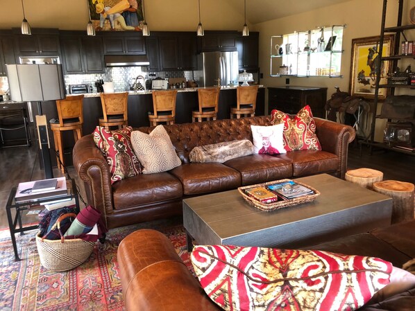 North Lodge Living Room features 2 Leather 8’ Couches and a Fireplace