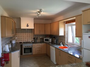 Large fully equipped kitchen with dishwasher