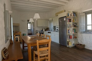 Main building - open space with kitchen, dining table, living area