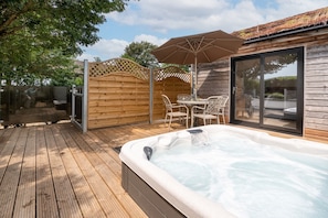 Decking with private hot tub and seating perfect for relaxing and socialising