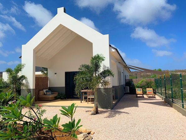 Front side, private area with your own front porch, private tropical garden
