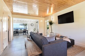 Living Room over looking dining area and Banana River.