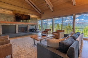 Living room with wall-to-wall windows of breathtaking panoramic mountain views!