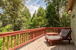 Relax and read, nestled high in the trees. Gaze out over the lake or walk down the street to the vil