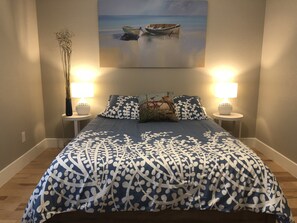 Beautiful bedroom with a brand new queen sized bed.