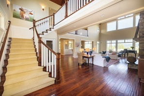 Main entrance with stairs leading to loft & upstairs bedrooms. 