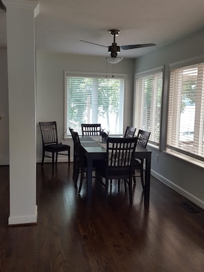 Dining Room w lake views.  Seats 8;  folding tables & chairs available.