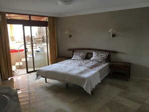 Bedroom 1 with double bed and large wardrobes with shared en-suite.